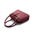 Elegant Maroon Handbag with Gold Accent Lock